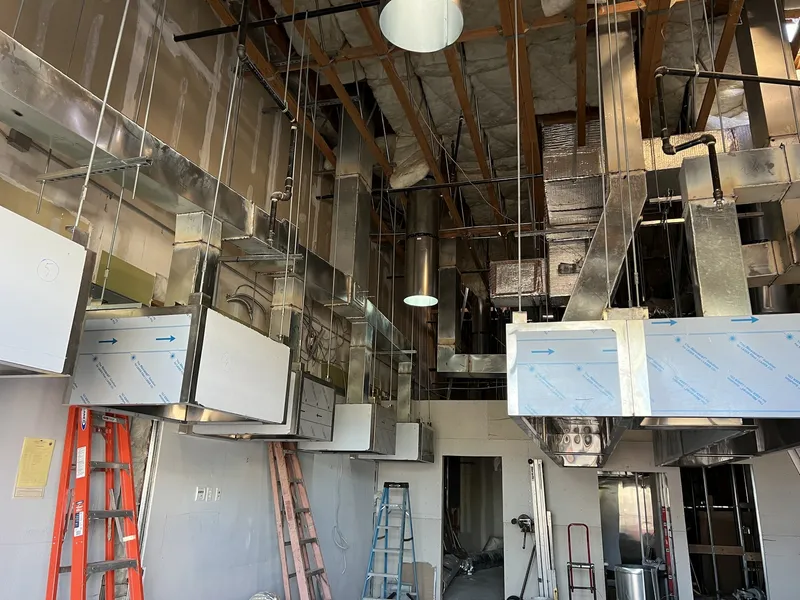 Commercial kitchen hood and ductwork installation in progress